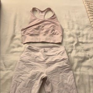 alo yoga light pink sports bra and leggings set